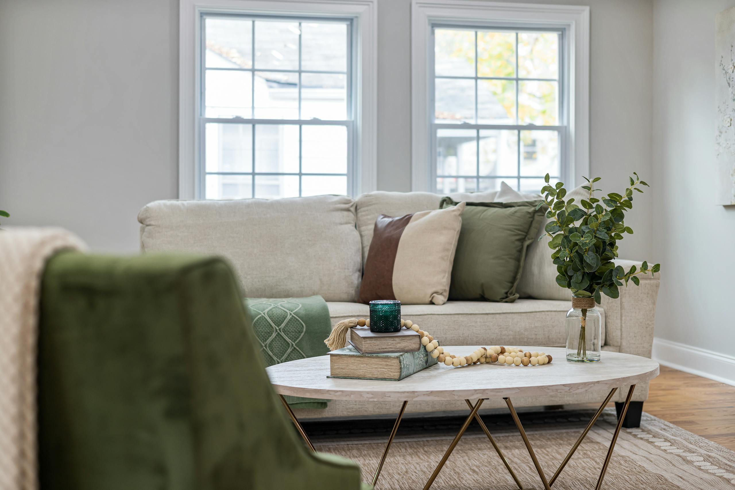 Stylish living room with cozy sofa, coffee table, and decorative elements.